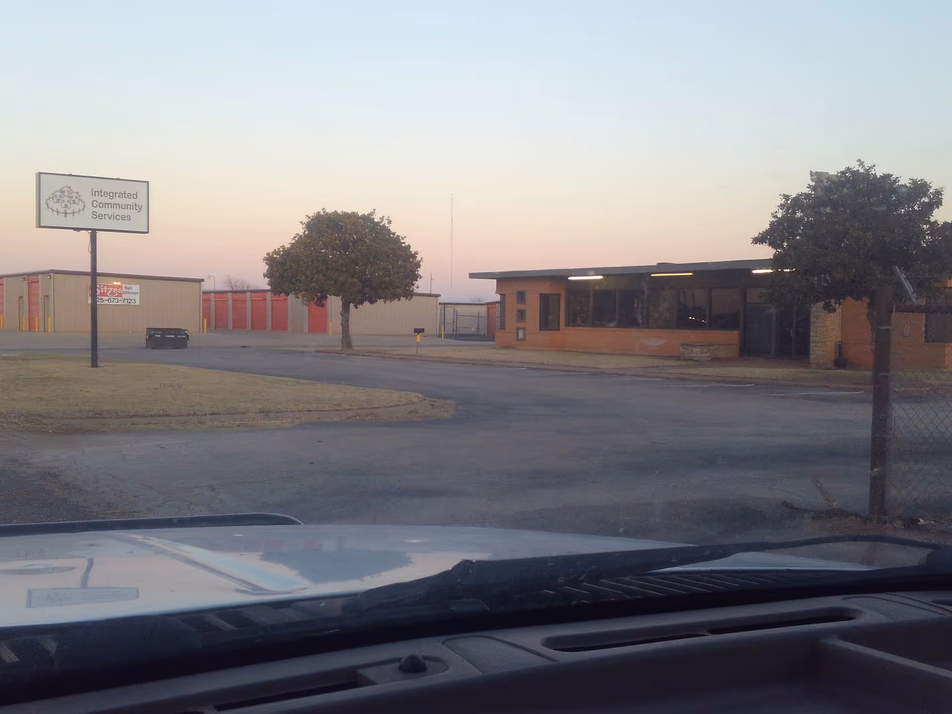 Exterior view of a brick Integrated Community Services building with sign