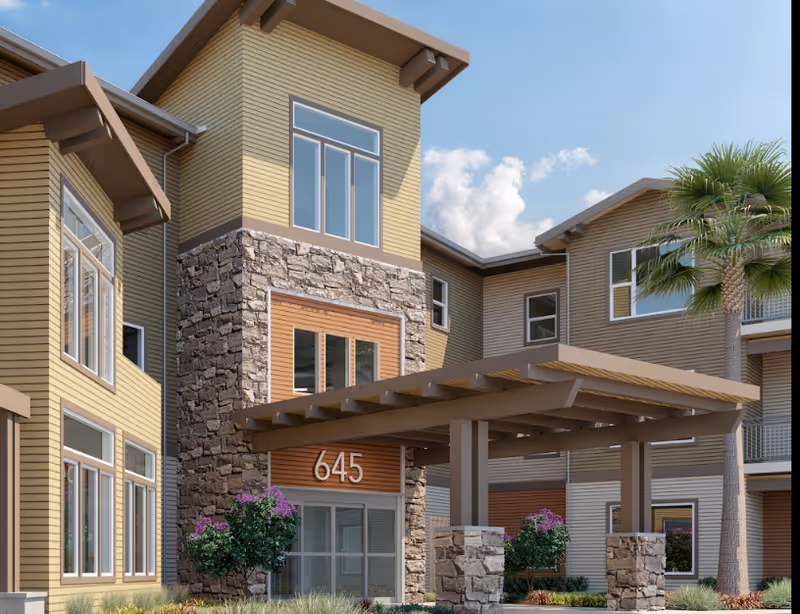 Prairie City Landing exterior with stone accents and a covered entrance at 645.