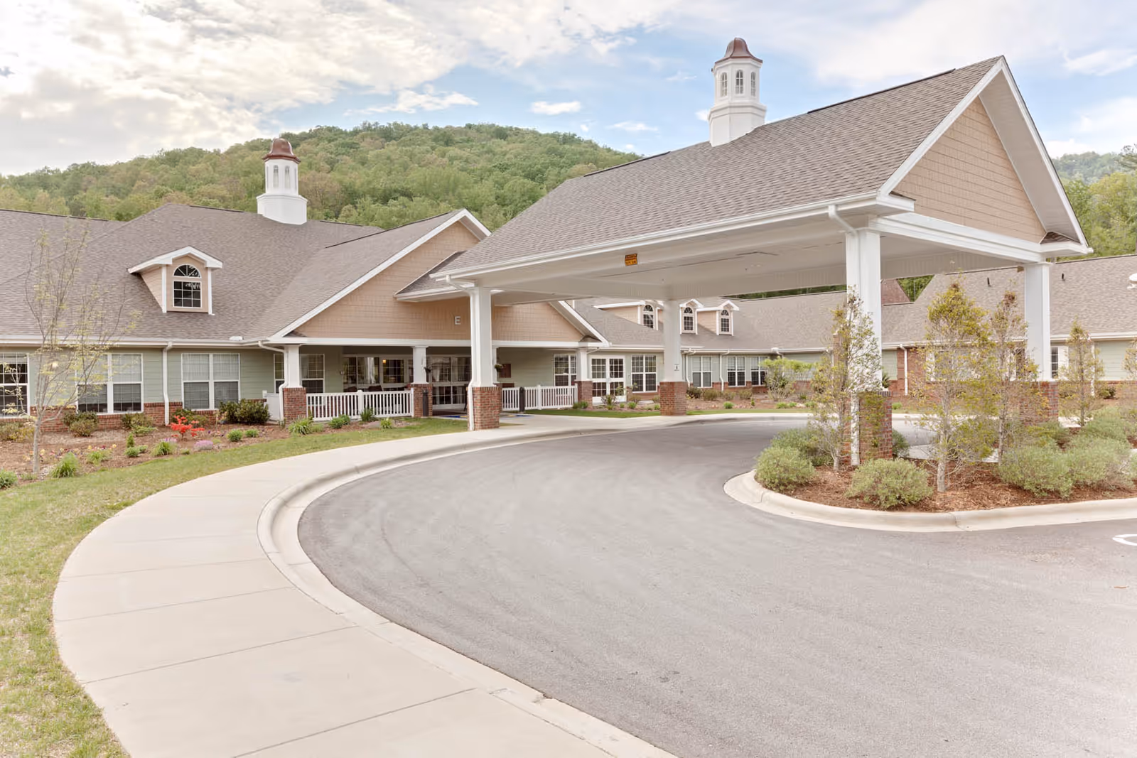 Exterior view of Nc State Veterans Home-Black Mountain with a curved driveway and porte-cochere.