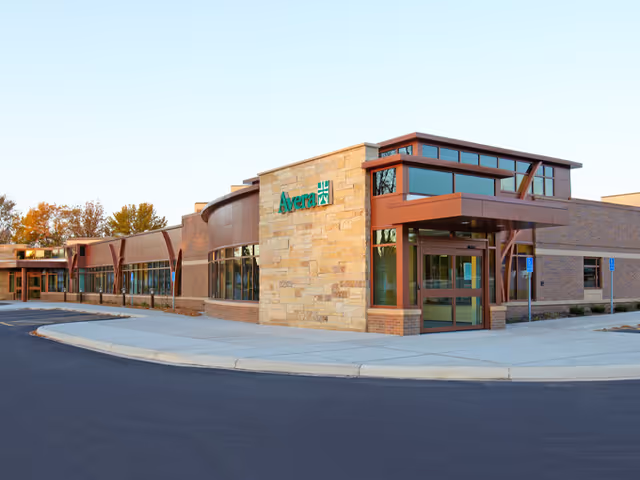 Avera@Home Hospice Marshall exterior building with glass entrance and stone facade.