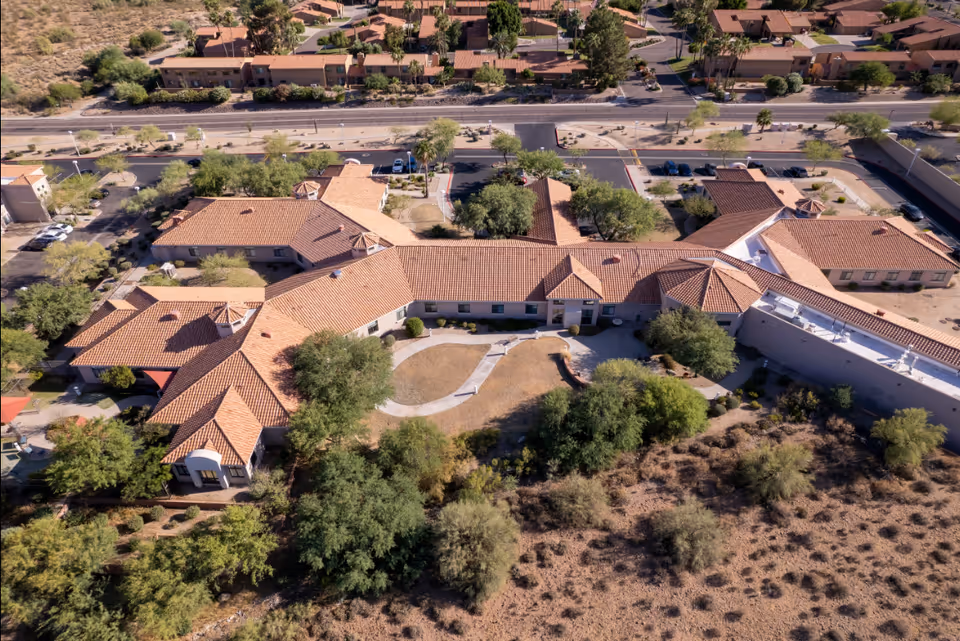Aerial view of Fountain Hills Post Acute campus with tan tiled roofs and desert landscaping.