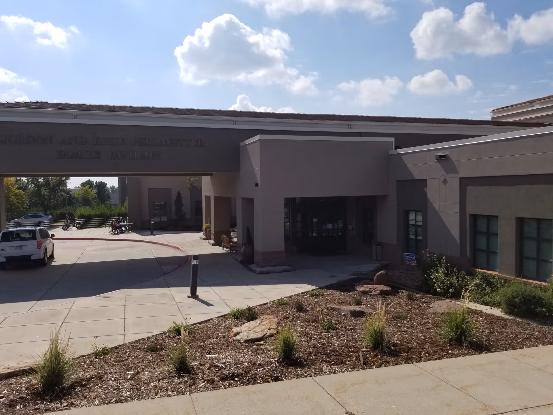 Shalom Park senior living facility exterior with entrance and landscaped front yard