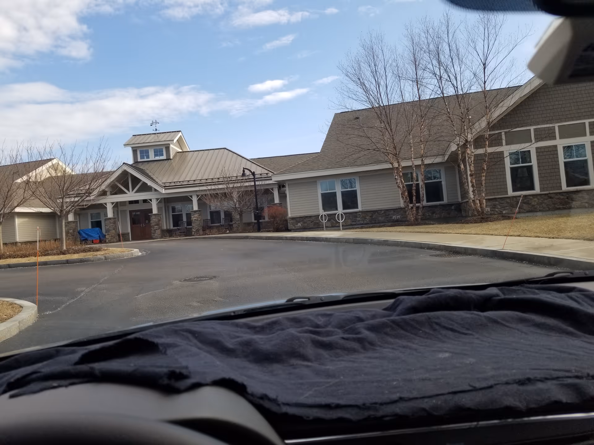 Exterior view of Bridges by Epoch at Lexington, showing the entrance and driveway.