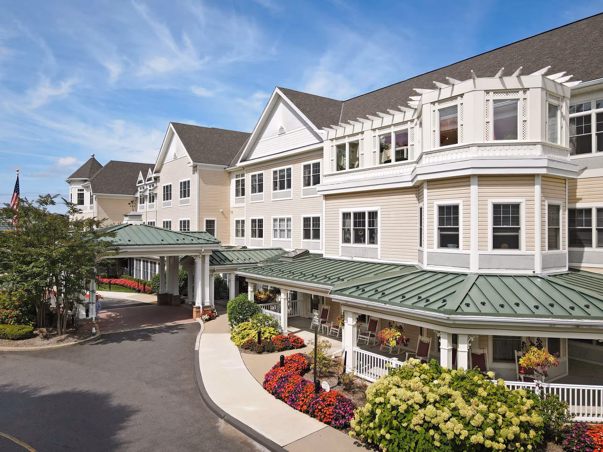 Exterior view of Sunrise of West Babylon, a senior living facility with a covered entrance.