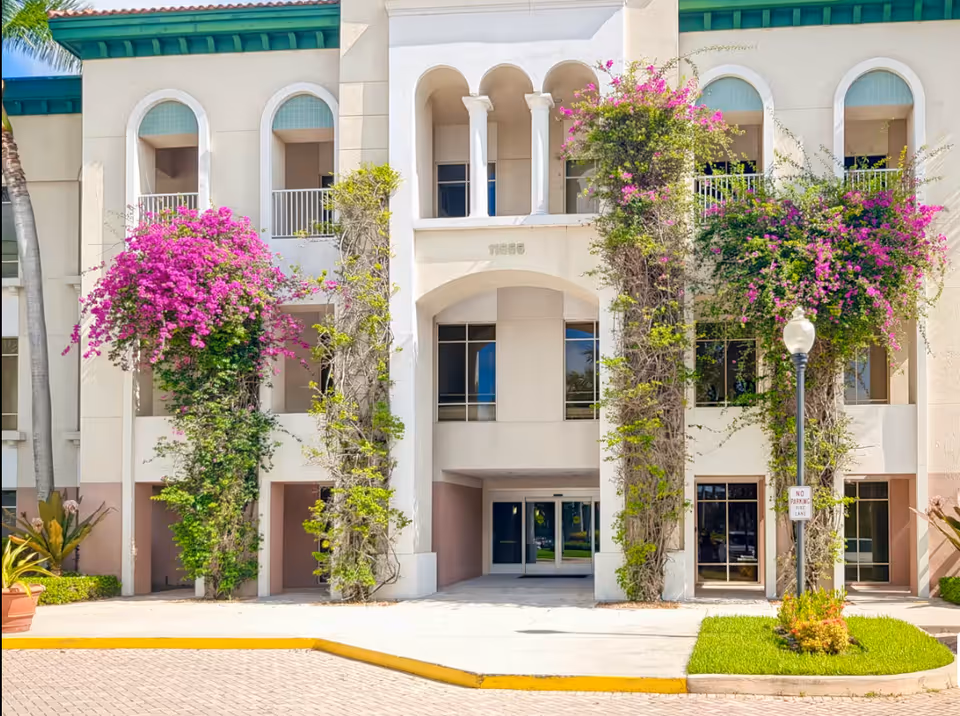 Facade of Preferred Care at Home of Fort Lauderdale with arches and flowering vines.