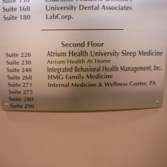Wall sign on the second floor listing medical suites and tenants.