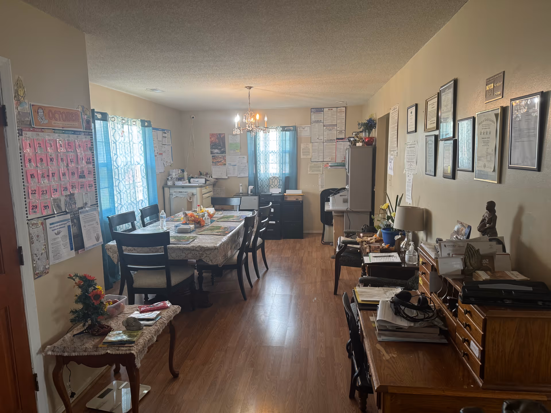 Interior dining room at Heavenly Touch Care Home with long table and chairs.