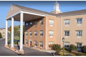 Front view of Rose View Nursing and Rehabilitation Center with a covered entrance.