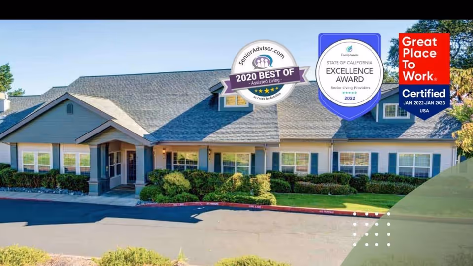 Exterior view of Mountain View Assisted Living and Memory Care building with award badges.
