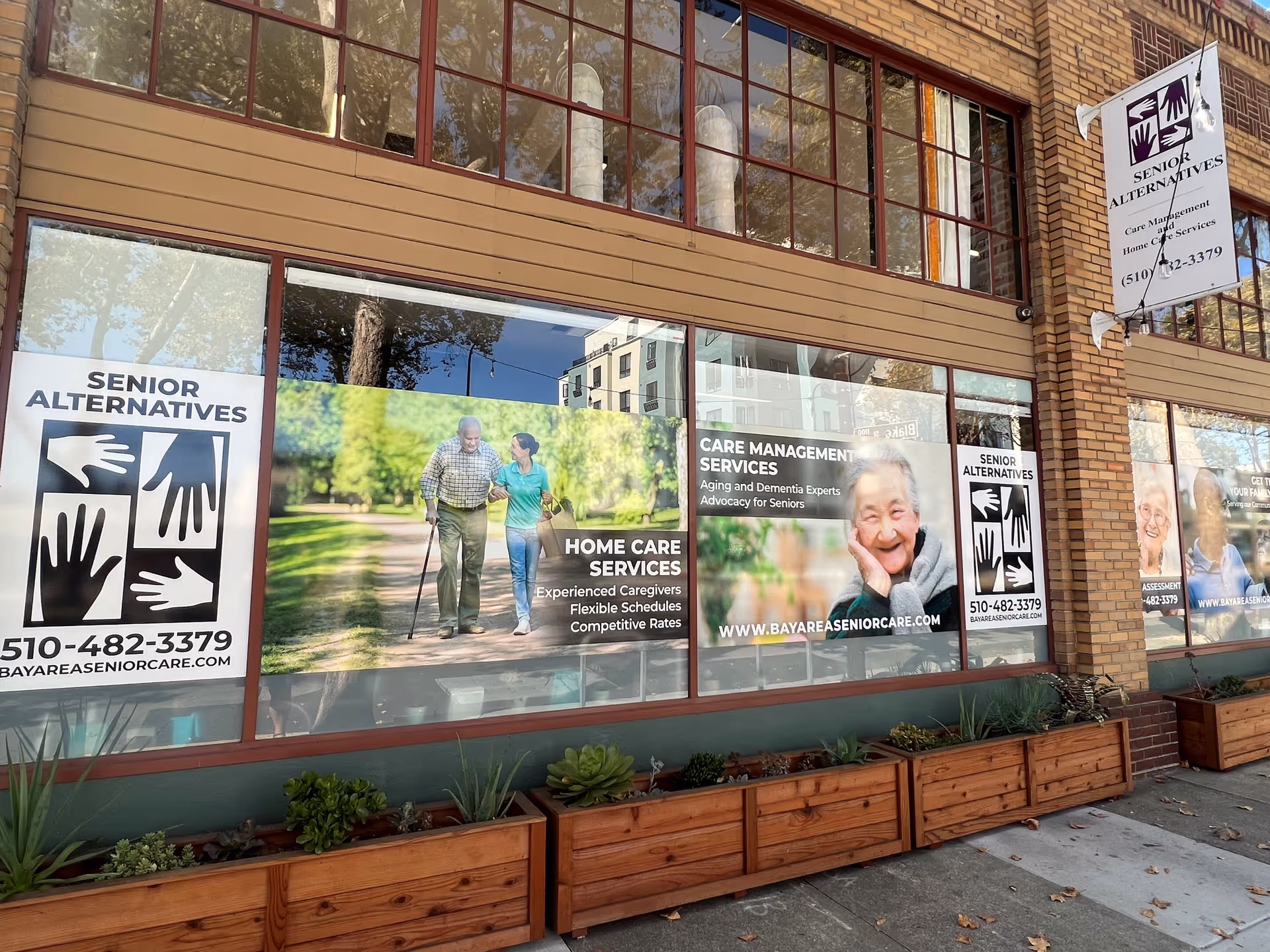 Exterior storefront of Senior Alternatives with large banners advertising home care services.