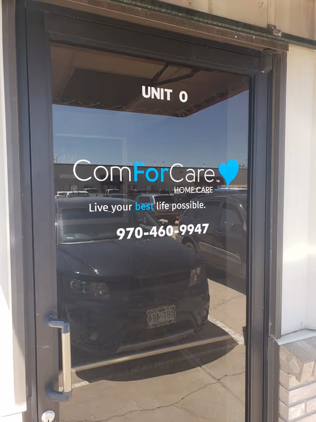 Front entrance door with ComForCare branding and Unit 0 signage