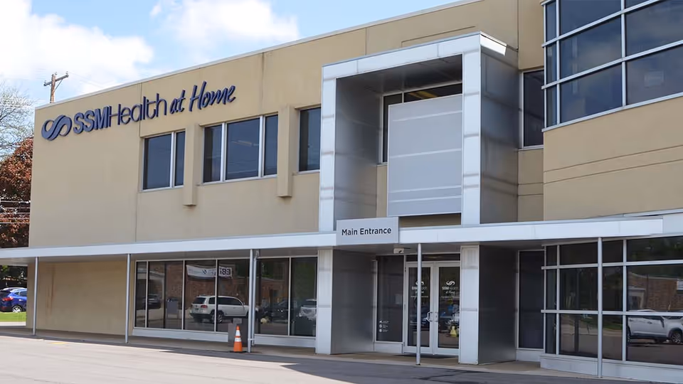 Exterior view of SSM Health at Home building with main entrance and glass storefront.