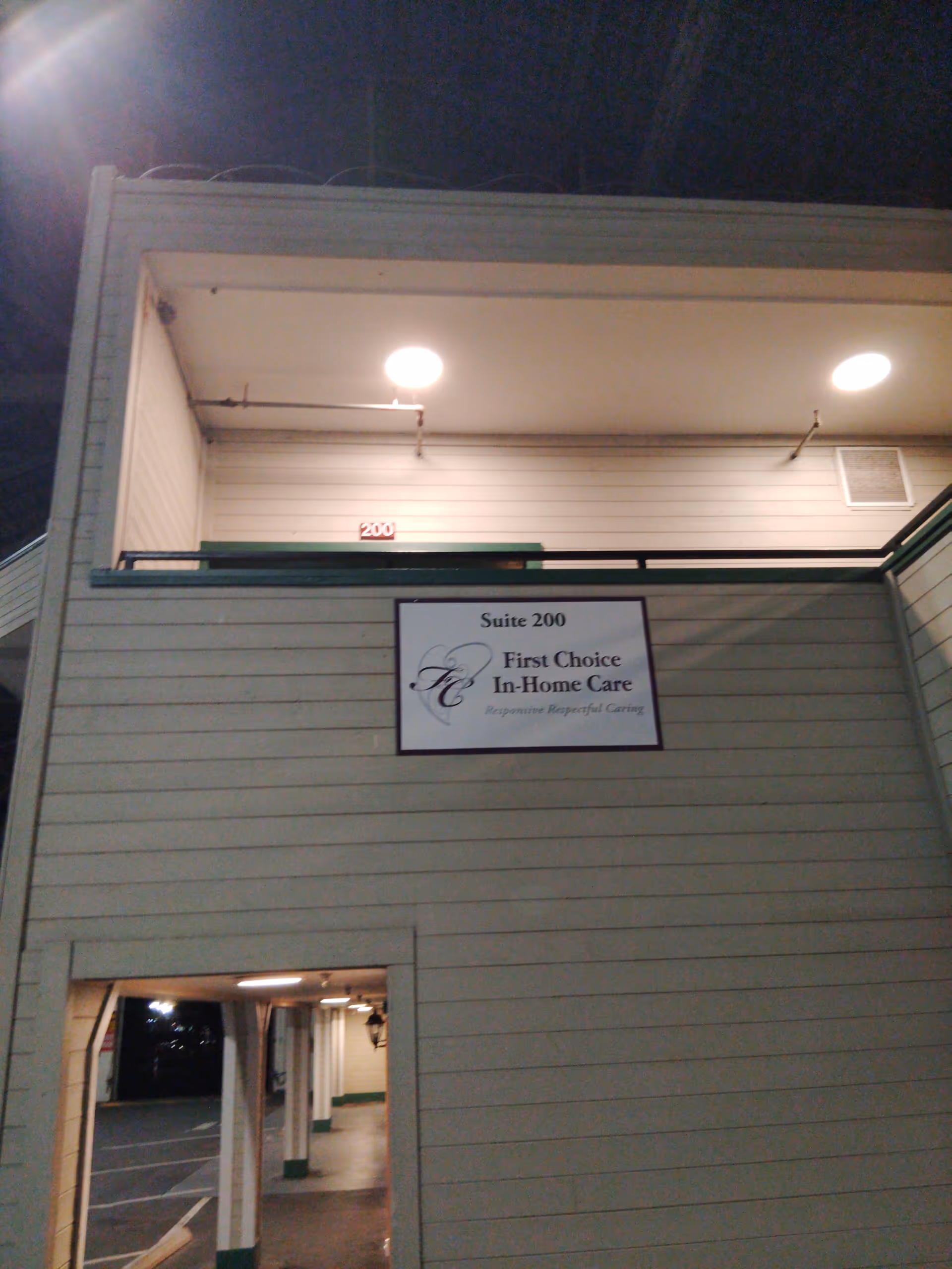 Exterior view of a building with a sign reading Suite 200, First Choice In-Home Care