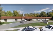 Exterior of Willow Wood Care Center with parked cars along a driveway.