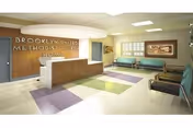 Lobby and reception area of Brooklyn United Methodist Church Home with benches and colorful floors.