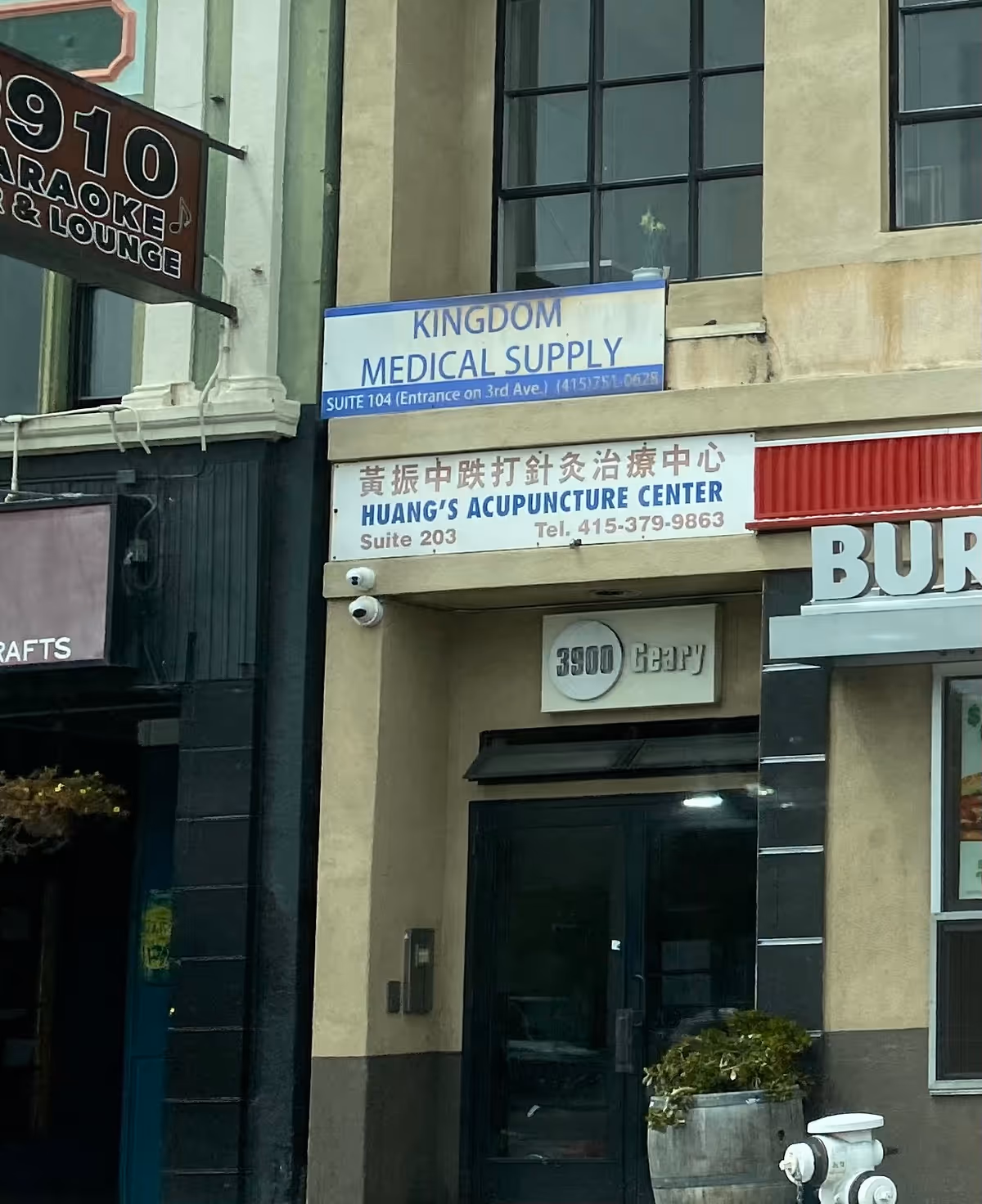 Street-level view of a storefront with Kingdom Medical Supply sign above entrance.