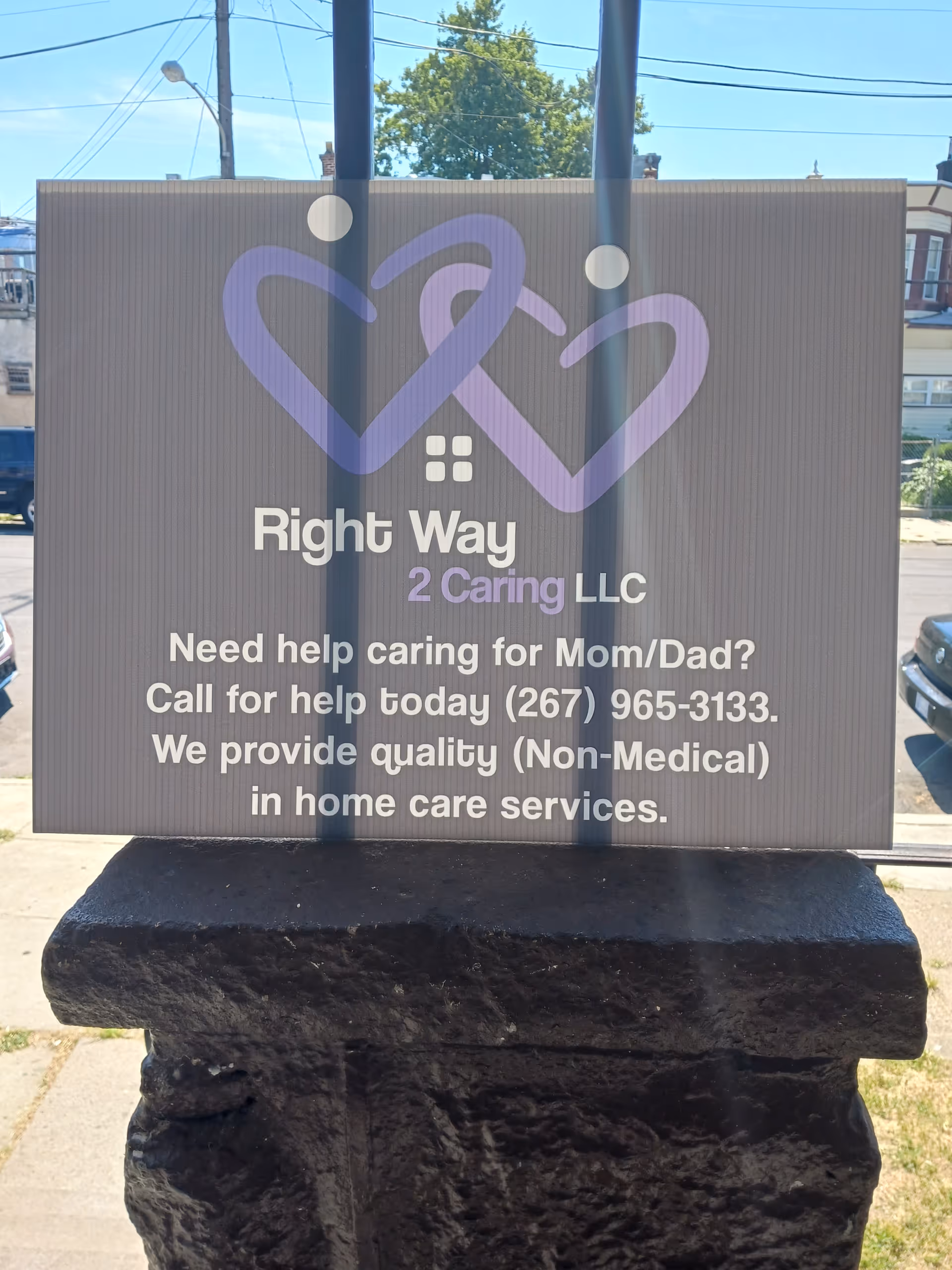 Outdoor sign for Right Way 2 Caring LLC featuring a purple heart logo