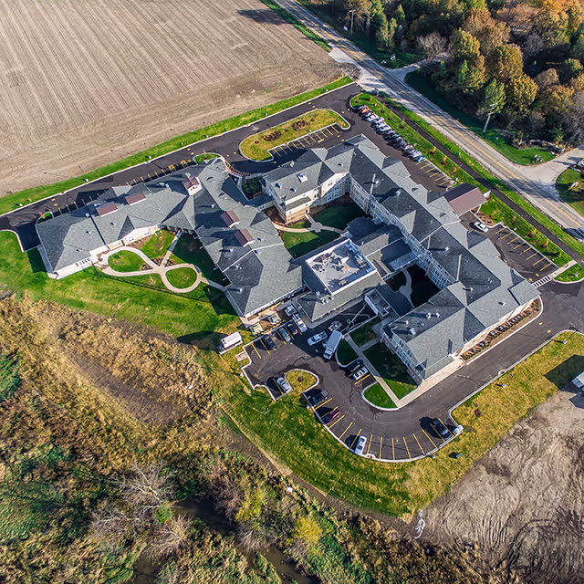 Aerial view of Heartis Peoria senior living facility with multiple wings and surrounding landscaping.