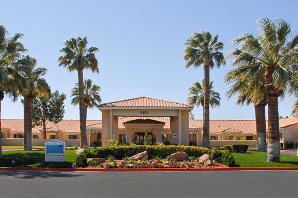 Exterior view of Life Care Center of Las Vegas entrance with palm trees
