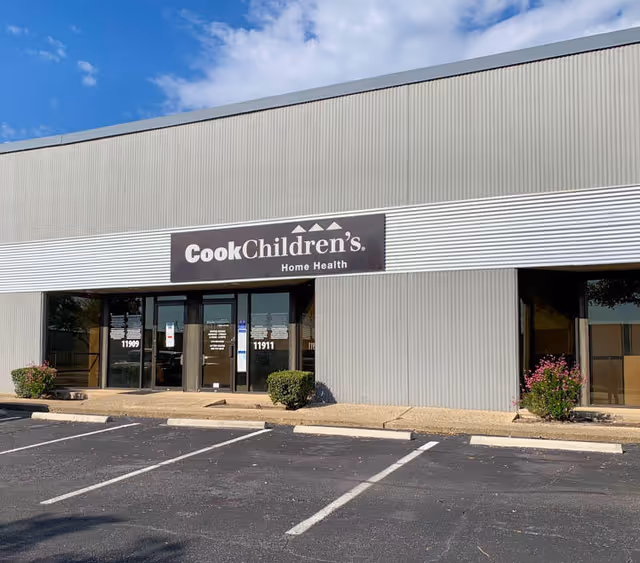 Exterior view of Cook Children's Home Health storefront with parking lot.