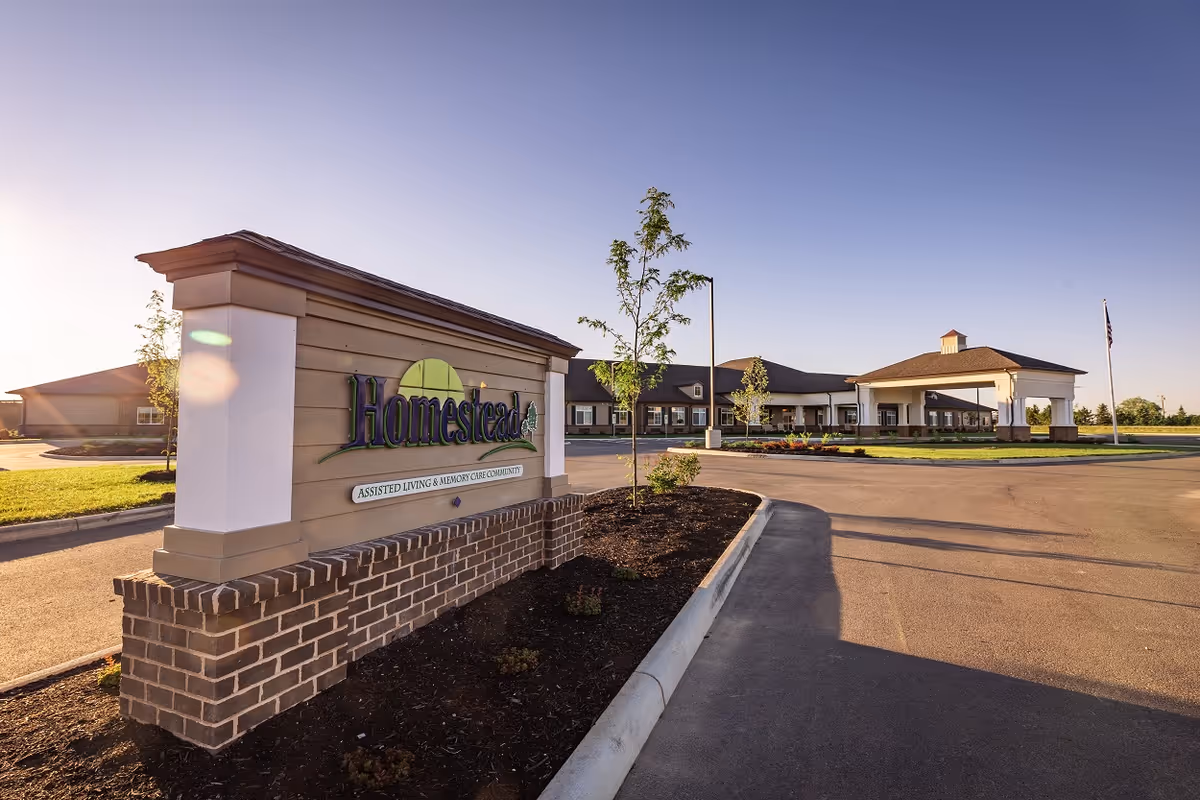 Exterior view of Homestead at Towne Center with sign and front entrance.