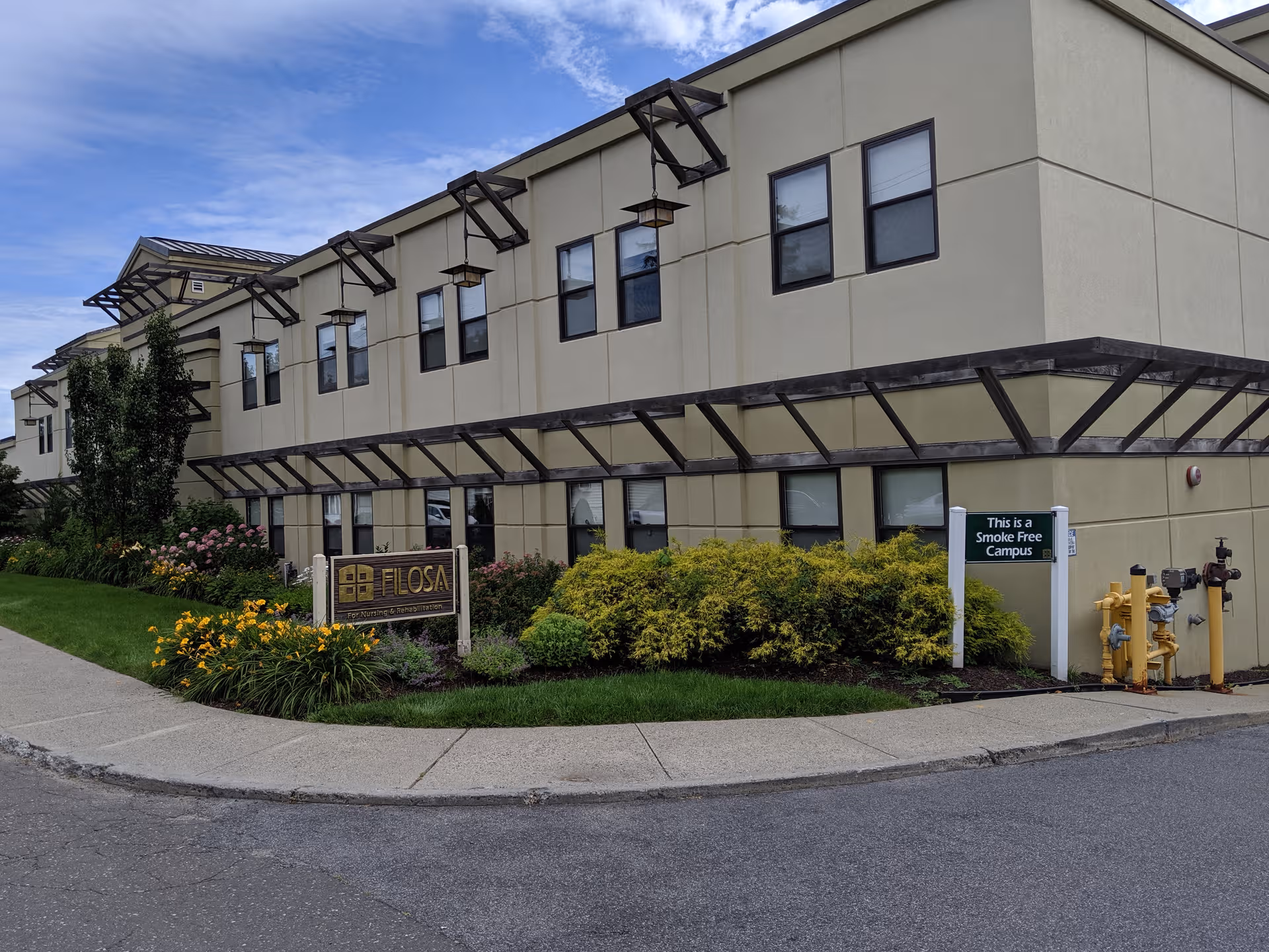 Exterior view of Havencare at Filosa facility with landscaped front and sign.