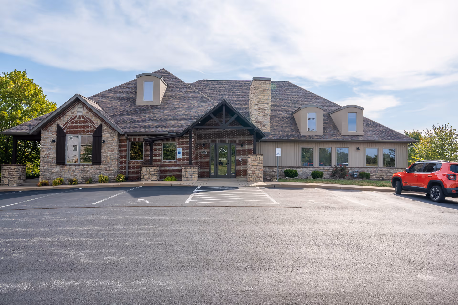 Front exterior of Haven Home Health and Hospice with a spacious parking lot.