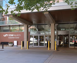 Exterior view of the SSM Health Outpatient Center entrance with glass doors and canopies.