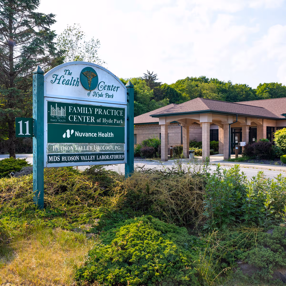 Exterior view of The Health Center sign and Hyde Park building entrance.