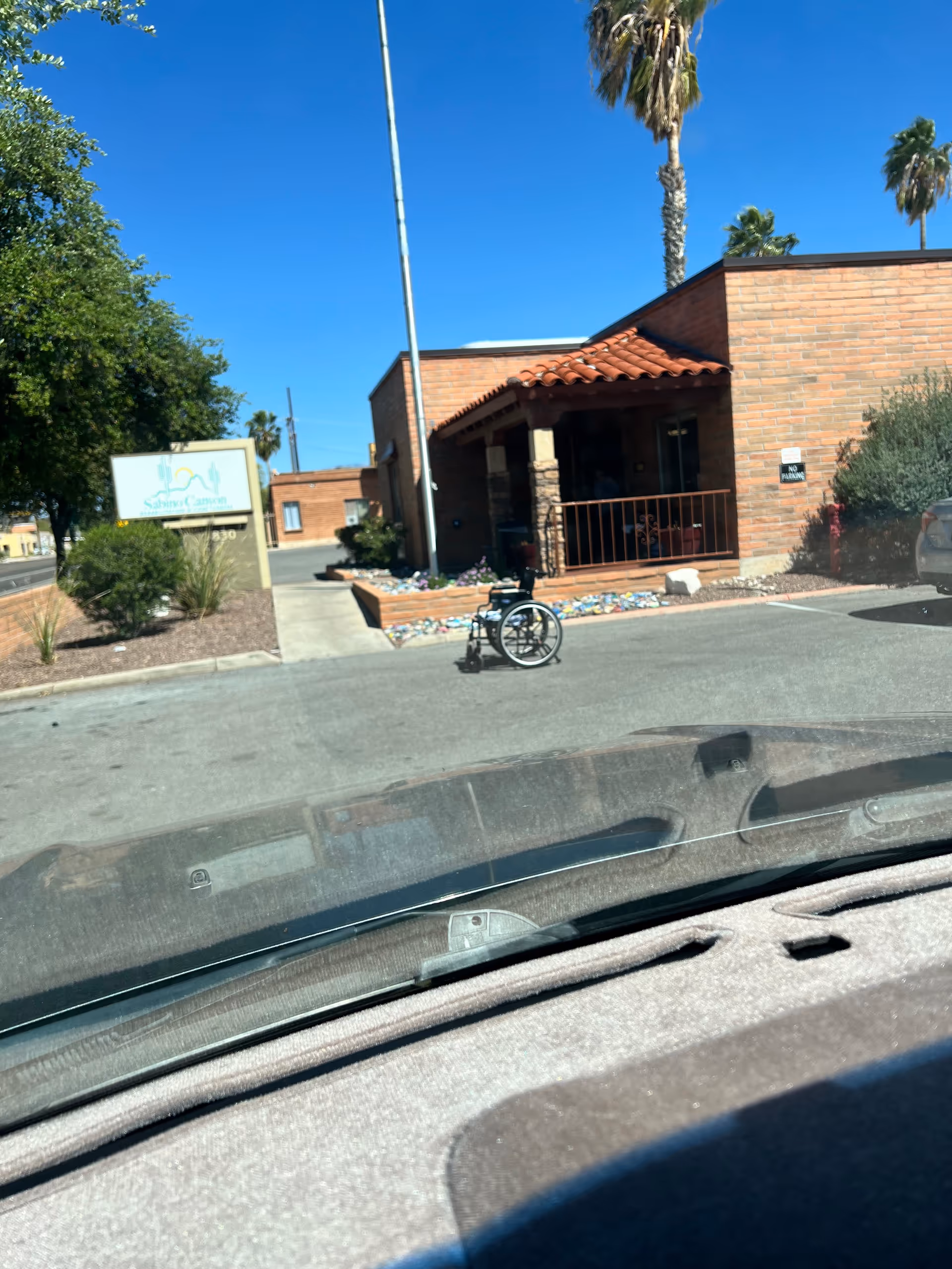 Front exterior of Sabino Canyon Rehabilitation & Care Center with wheelchair near entrance.