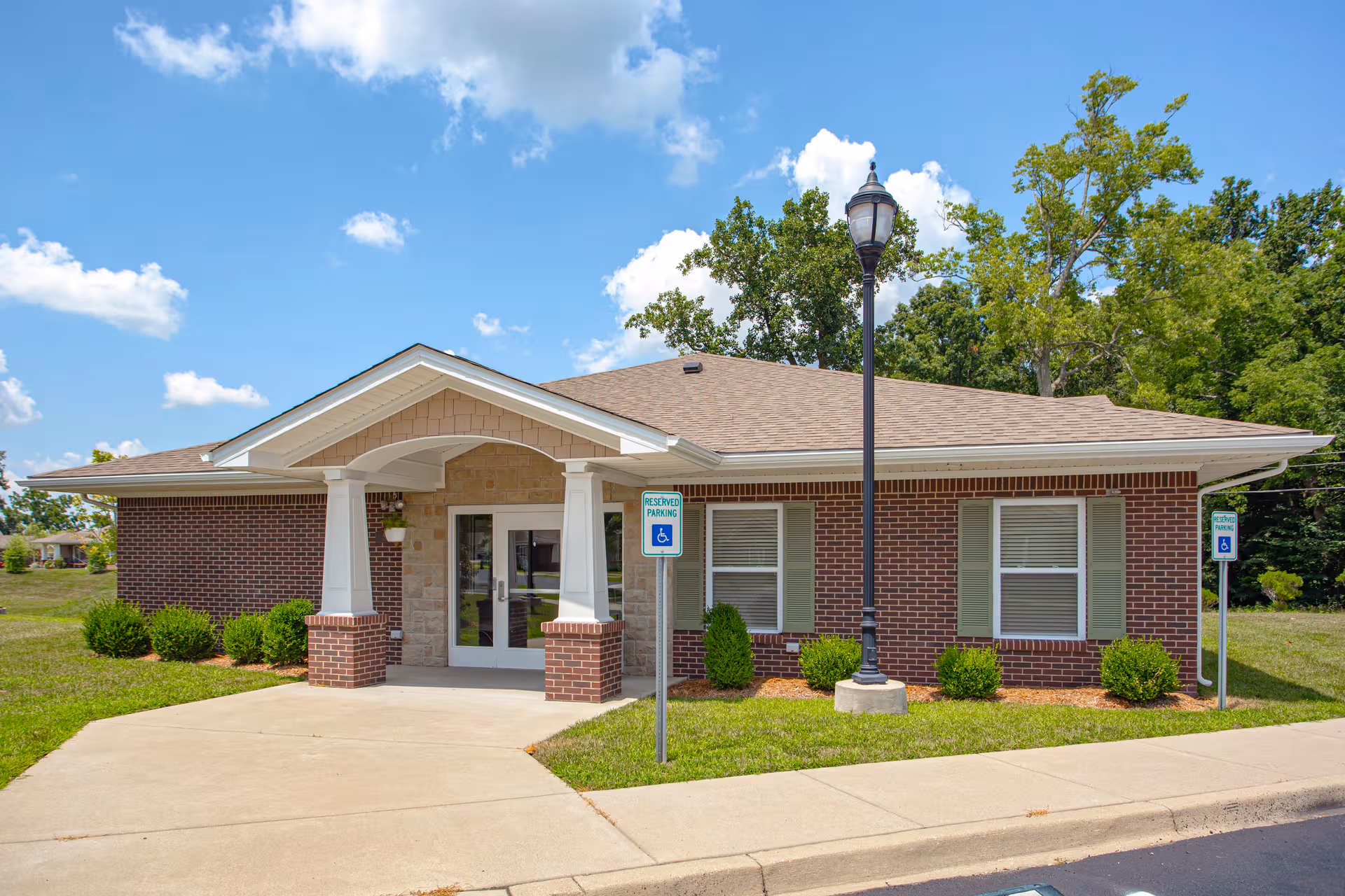Forest Springs Health Campus exterior: a single-story brick facility with a covered entrance.