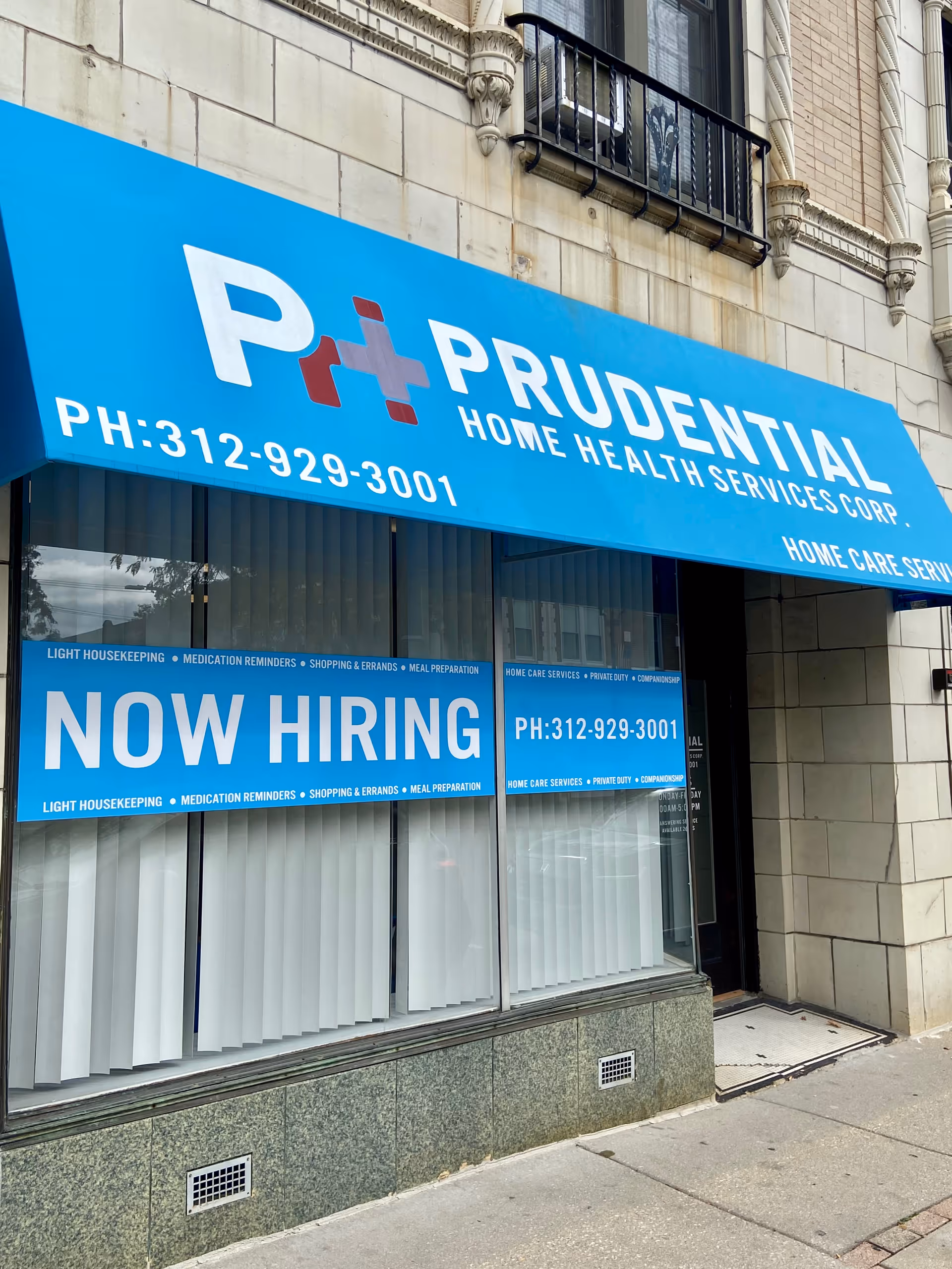 Blue storefront with Prudential Home Health Services sign and a large Now Hiring banner.
