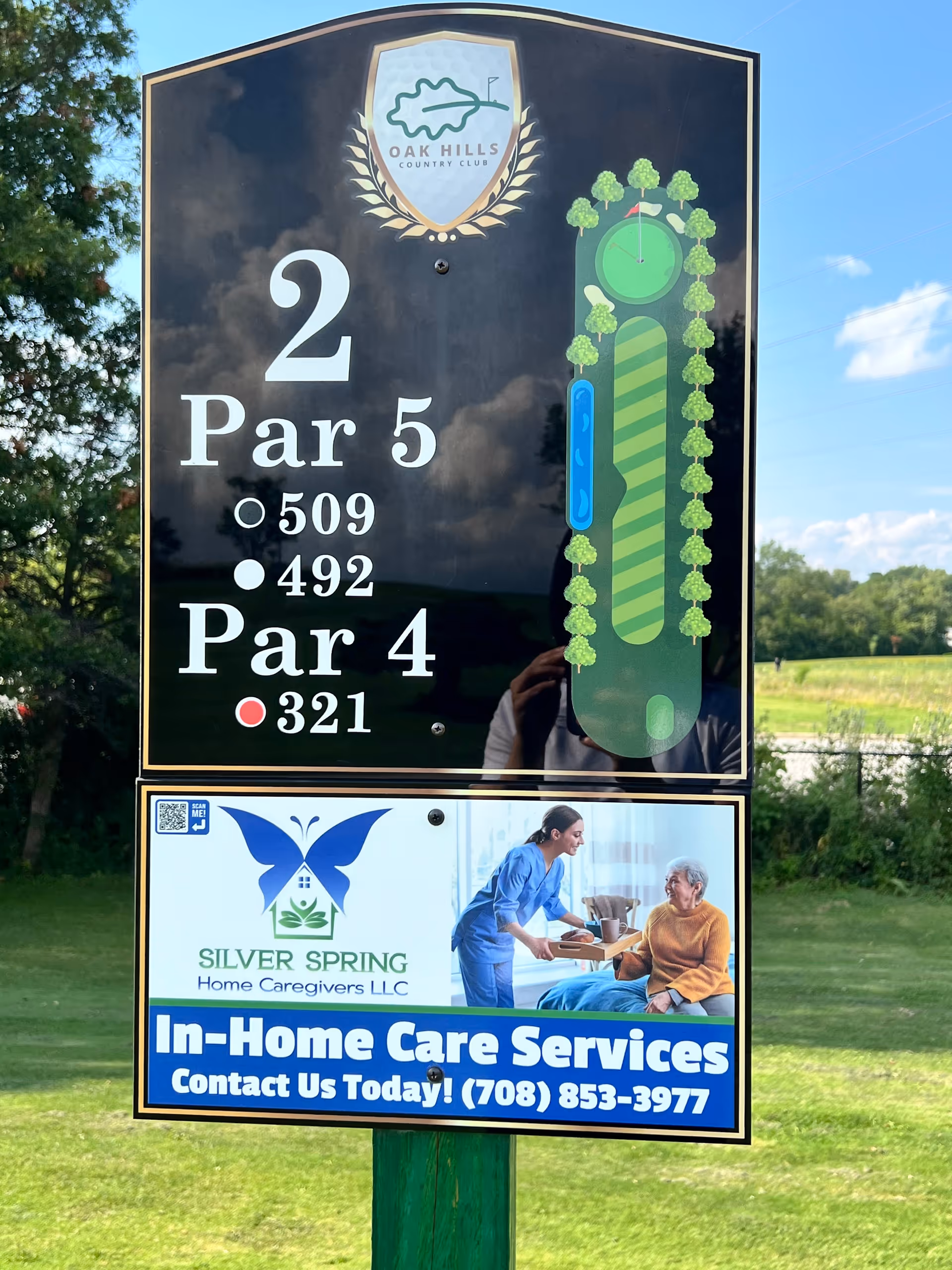 Outdoor signboard featuring Oak Hills Country Club and Silver Spring Home Caregivers LLC.