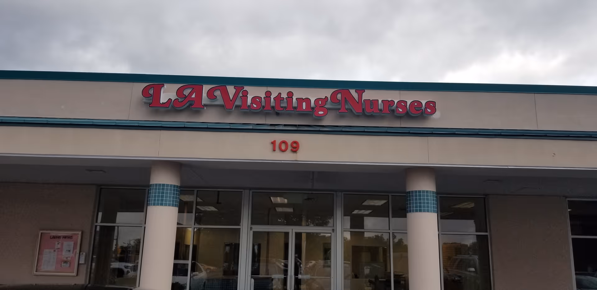Front of a beige building with LA Visiting Nurses sign and 109.