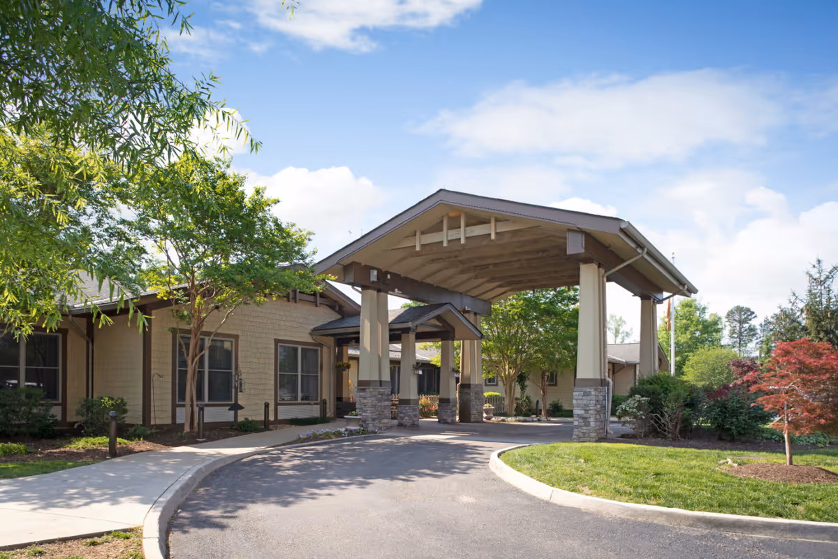 Sunrise at Bon Air exterior entrance features a covered drive and manicured landscaping.