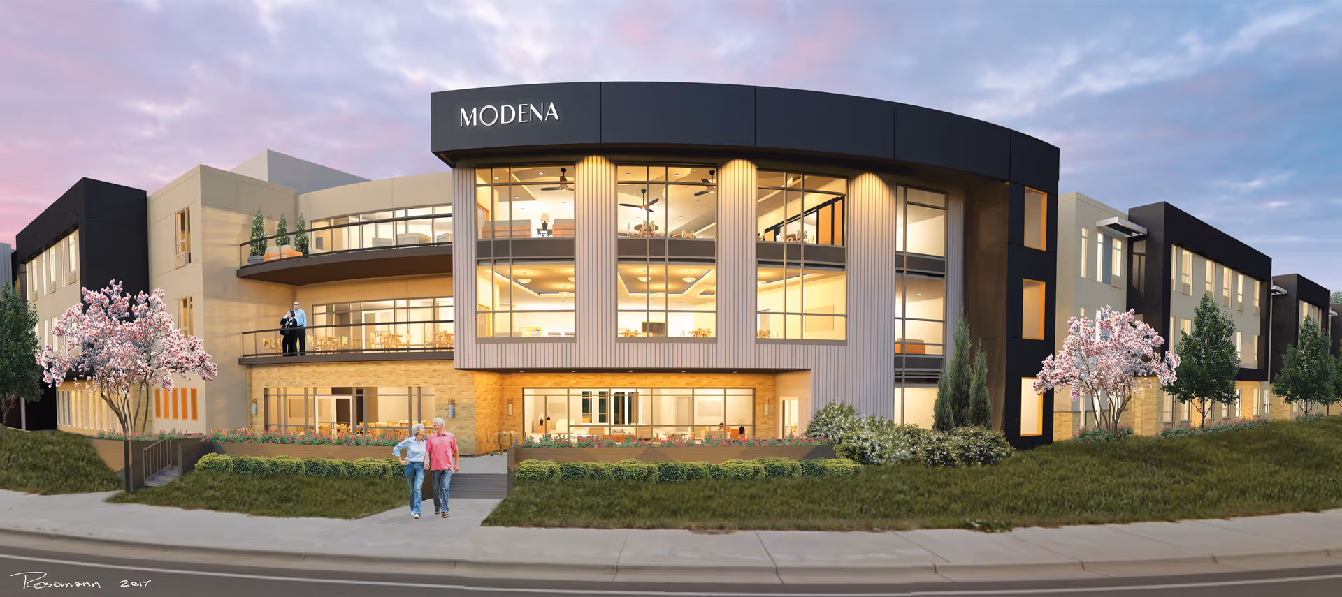 Exterior view of Modena Cherry Creek senior living facility at dusk, showing a modern three-story building with large windows, landscaped greenery, and blooming trees. Two elderly people are walking on the sidewalk in front of the building, and two others are standing on a balcony.
