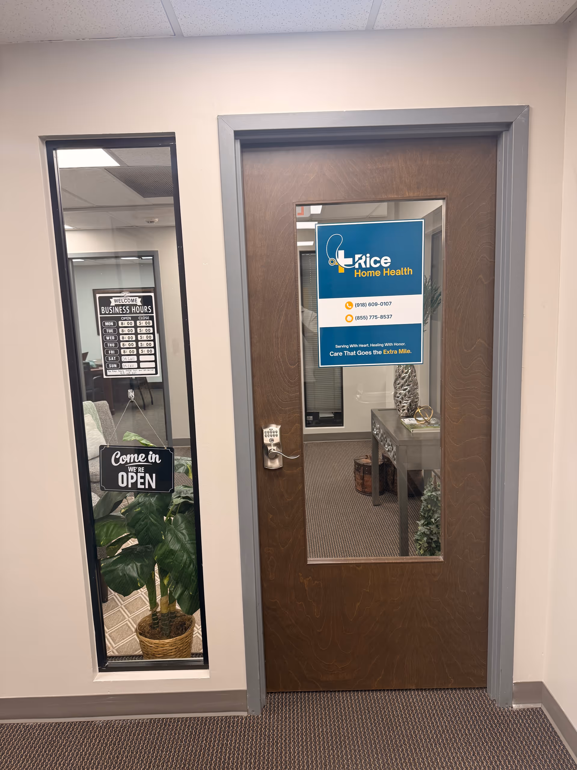 Wooden door with window and Rice Home Health sign in an office hallway