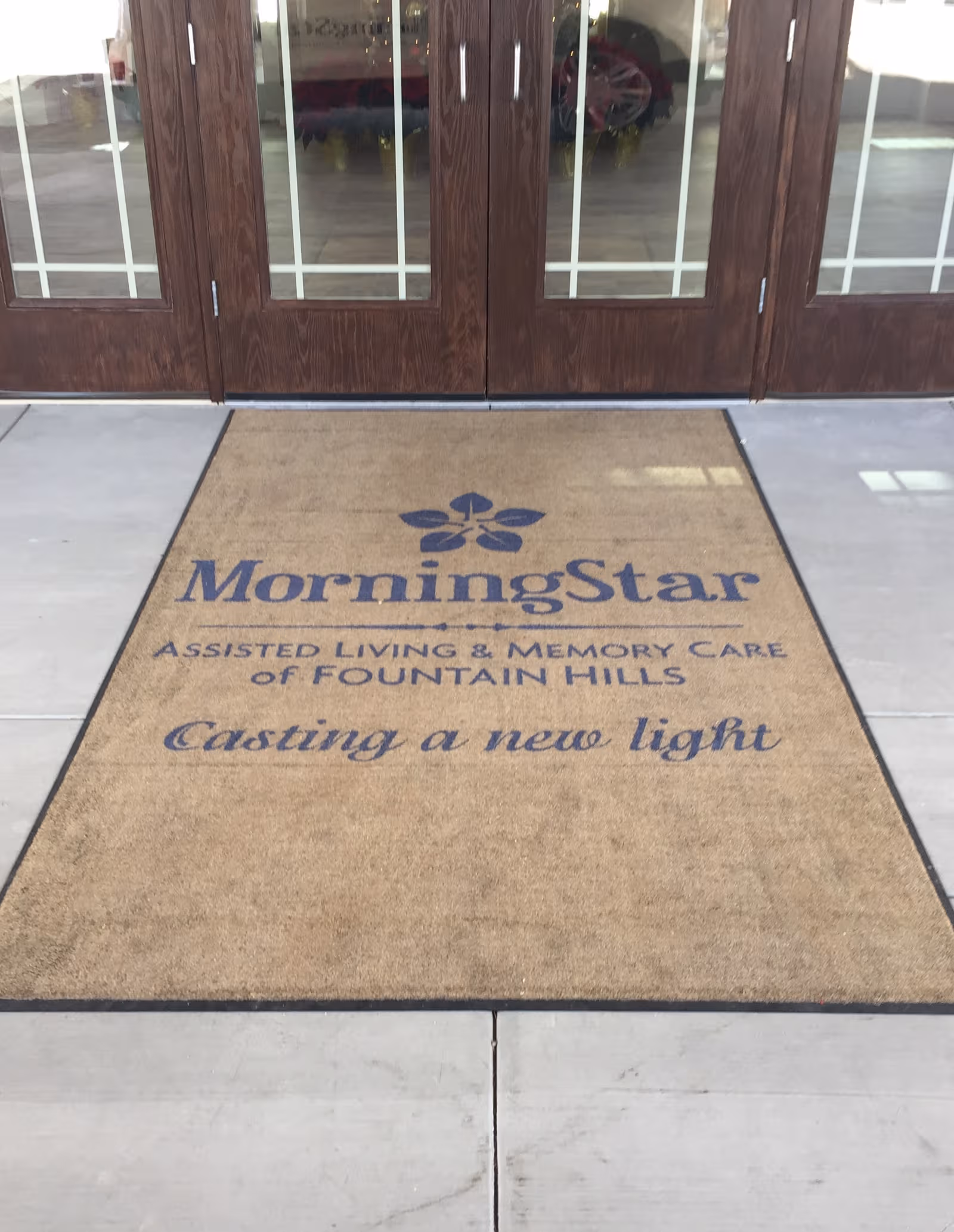Front entrance featuring MorningStar doormat with assisted living and memory care messaging.