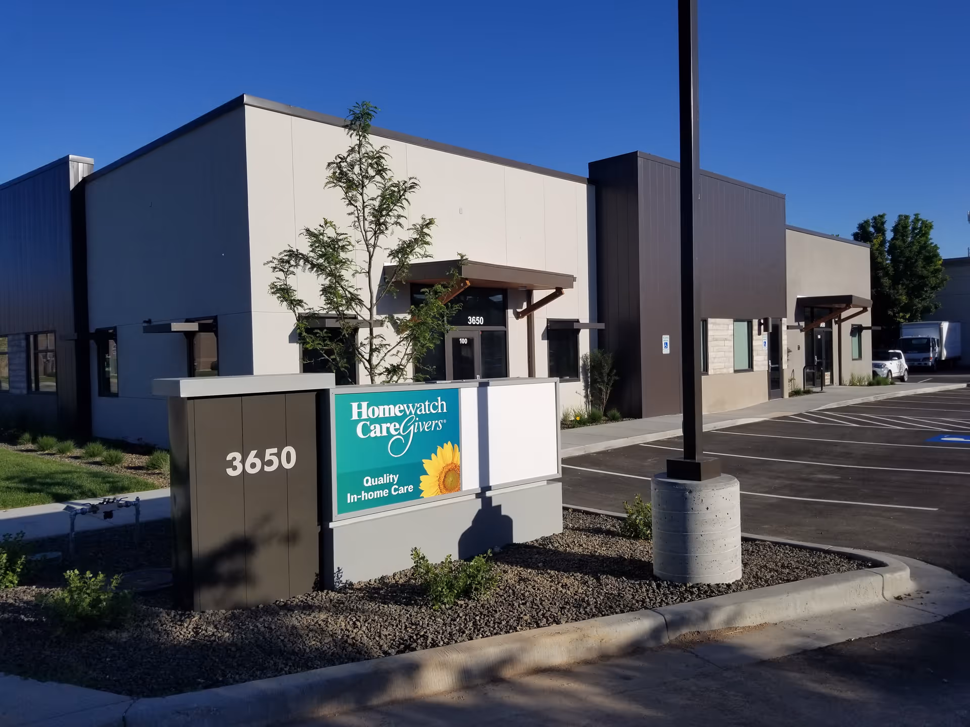 Exterior view of Homewatch CareGivers Boise facility with sign and parking lot