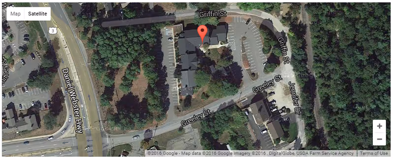 Satellite view of a senior living campus with parking lots and trees