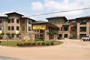 Exterior view of Waycross Health & Rehabilitation building with entrance and landscaping.