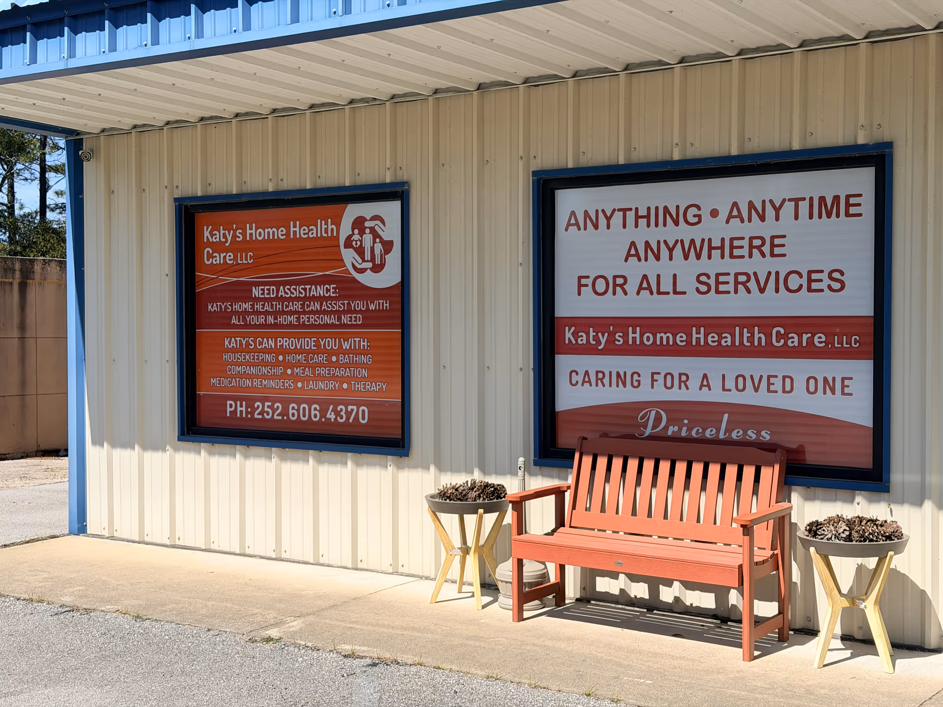Exterior of Katy's Home Health Care building with a red bench and large service signs.