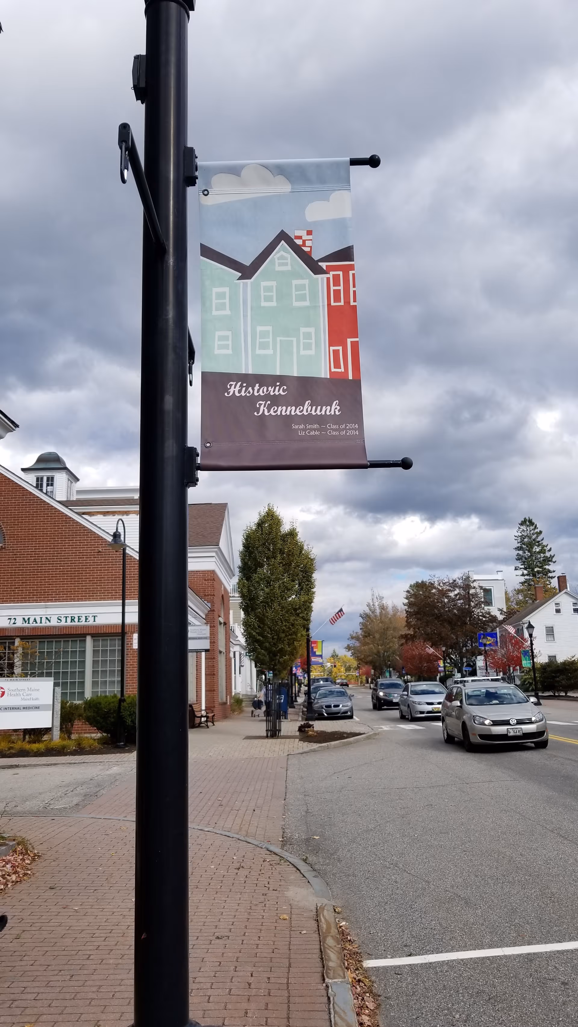 Lamppost banner advertising Historic Kennebunk along a downtown street.