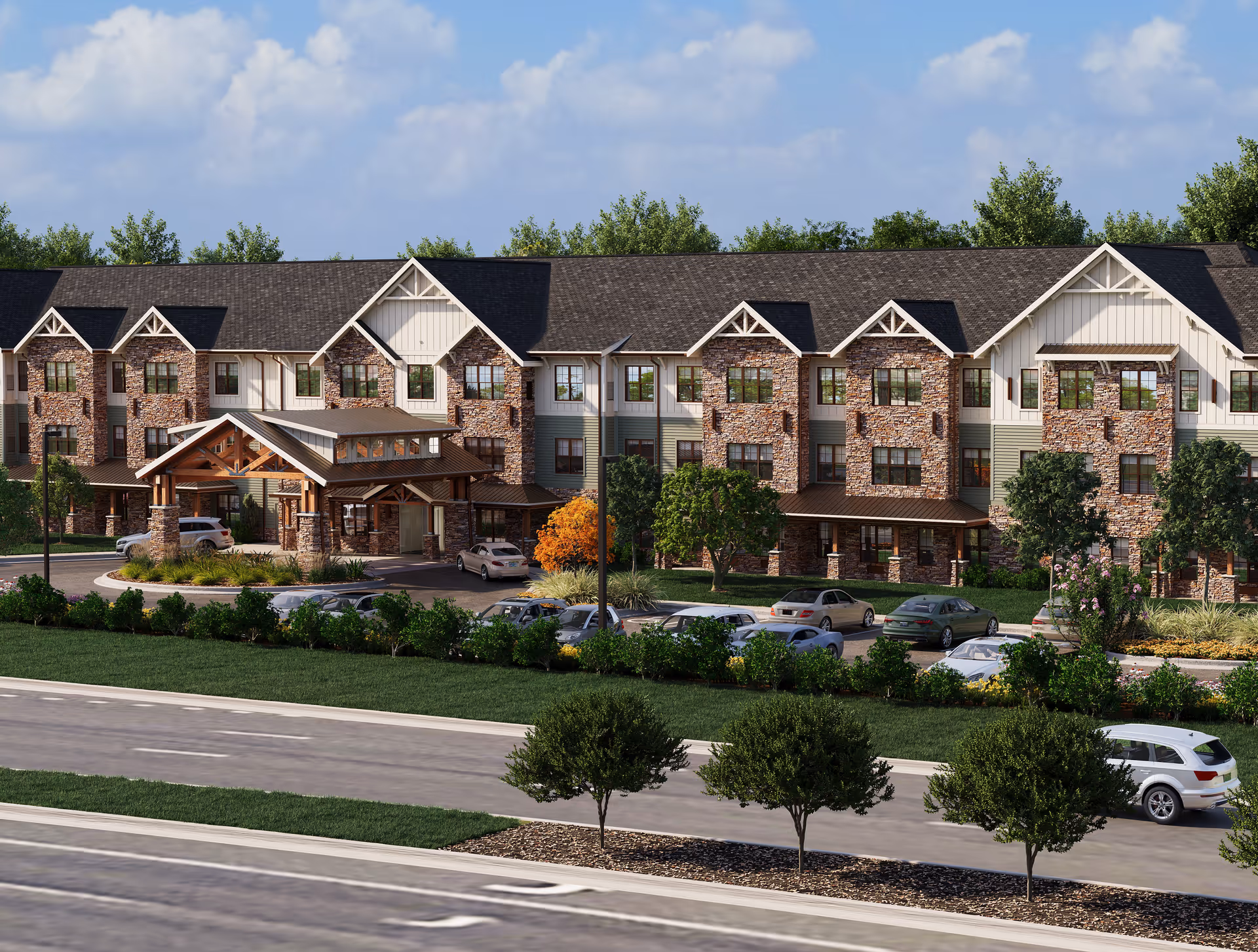 Watercrest Fredericksburg senior living building with brick facade and entrance canopy, cars parked outside.