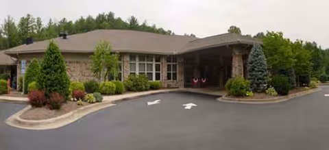Front view of Brookdale Lenoir senior living facility entrance with manicured landscaping
