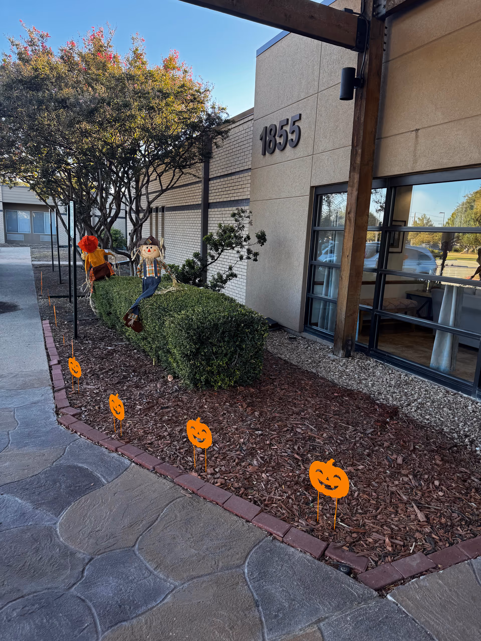 Exterior view of Brookhaven Nursing and Rehabilitation Center with Halloween decorations along the entrance.