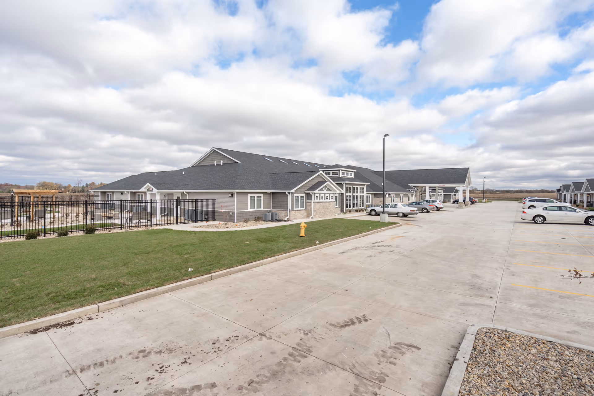 Reflections Memory Care Morton exterior with parking, entrance, and grassy landscaping.