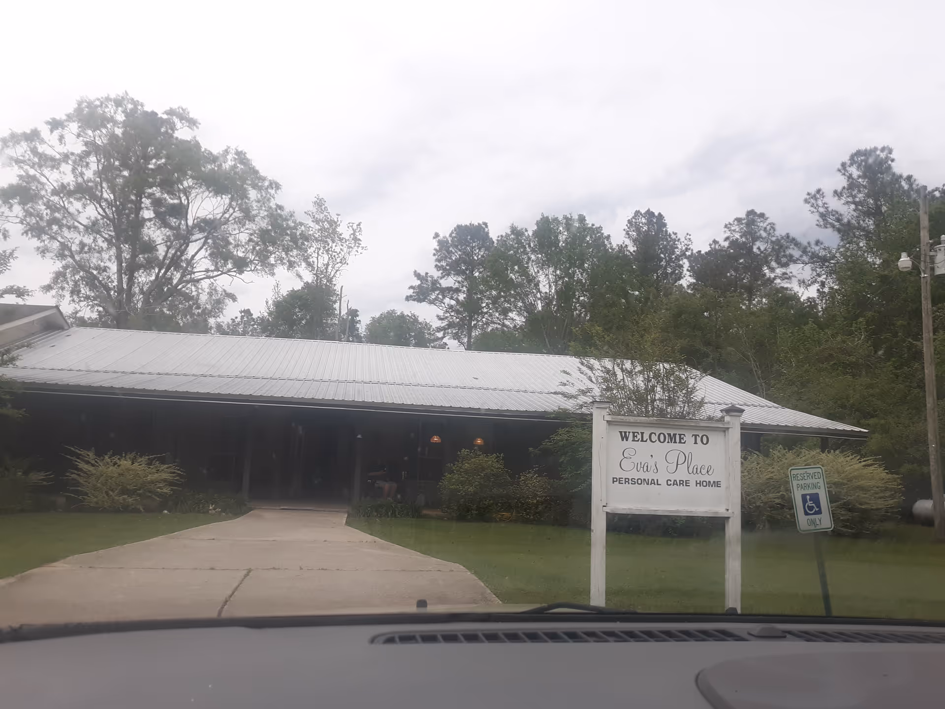 Front view of Eva's Place Personal Care Home with a driveway.