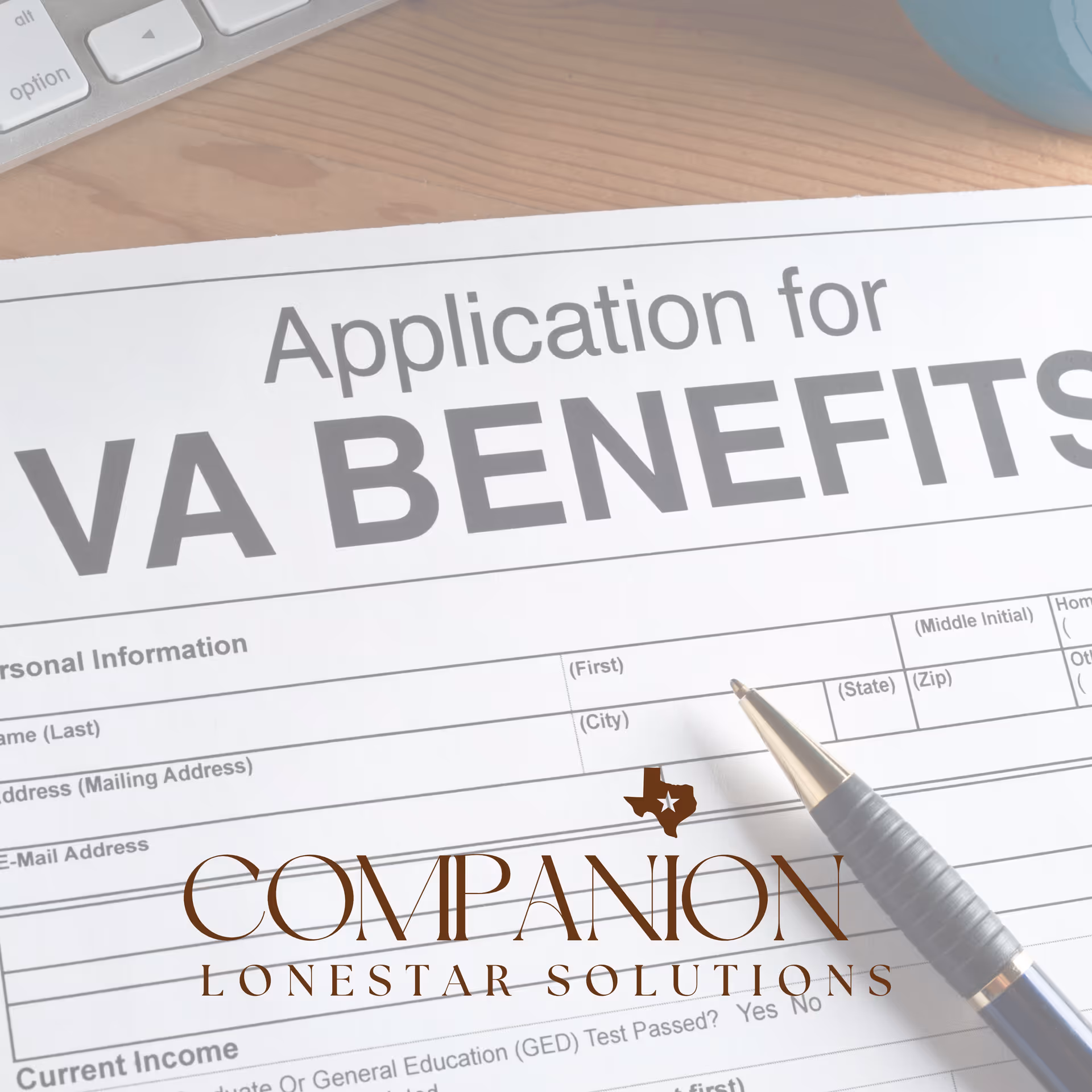 Close-up of a VA Benefits application form on a desk with a pen.