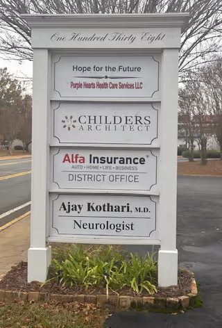 Outdoor signboard for Purple Hearts Health Care Services LLC with other tenants.